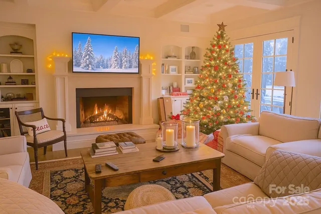 a living room with furniture a fireplace and a large window