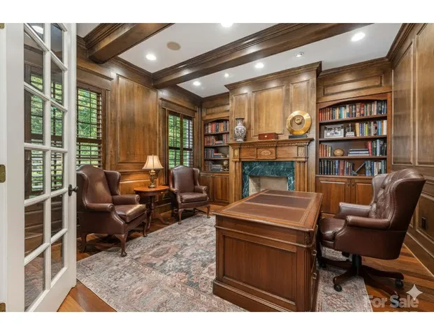 a room with furniture and a book shelf