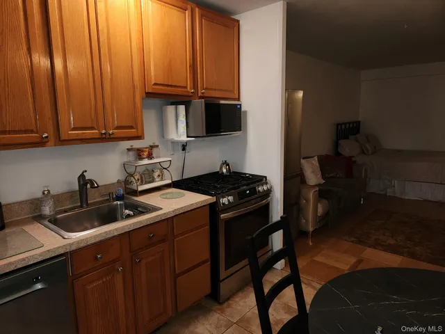 a front view of a building with sitting area