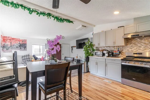 a kitchen with a table and chairs in it