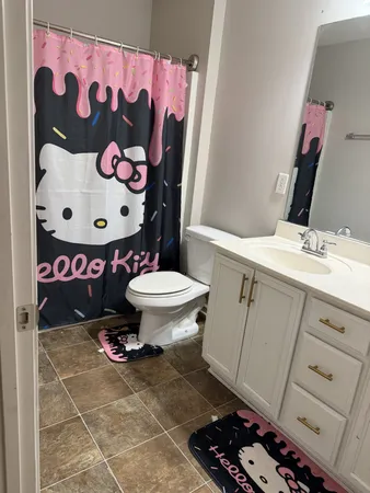 a room with toys and dresser