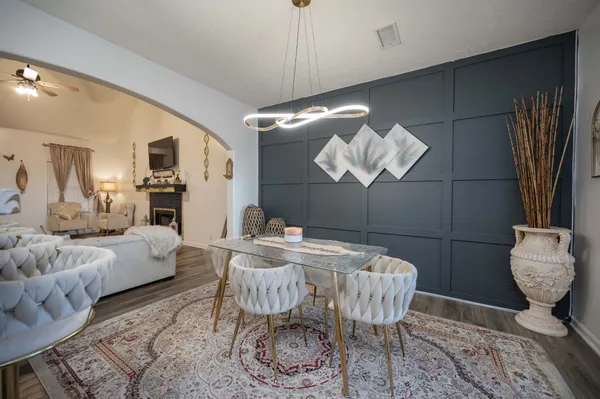 a dining room with furniture and window