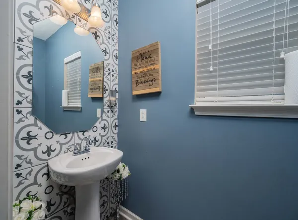 a bathroom with a sink and a mirror