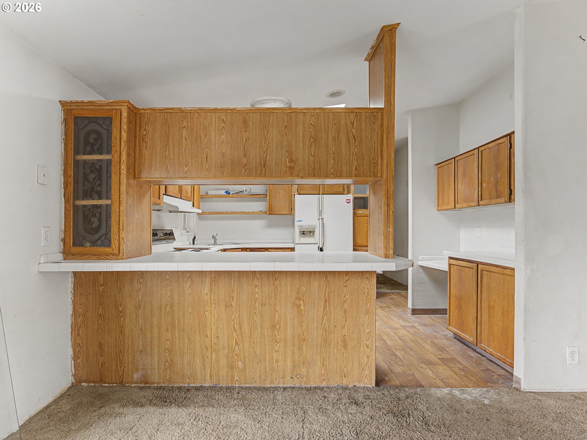 2965 Northeast 206th Place Fairview, OR 97024 - Photo 14 of 44 a living room with stainless steel appliances kitchen island granite countertop furniture a rug and a window