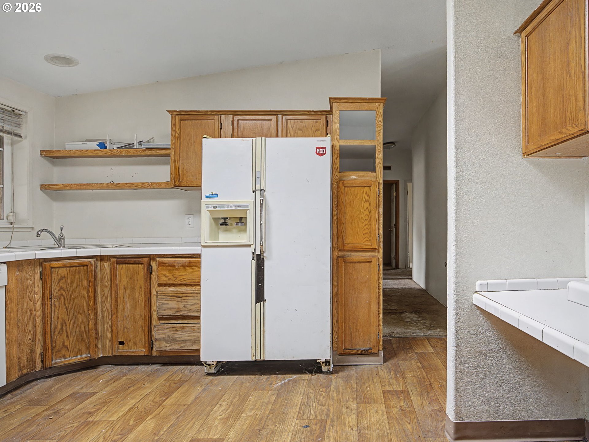 2965 Northeast 206th Place Fairview, OR 97024 - Photo 15 of 44 a view of a kitchen with wooden floor and staircase