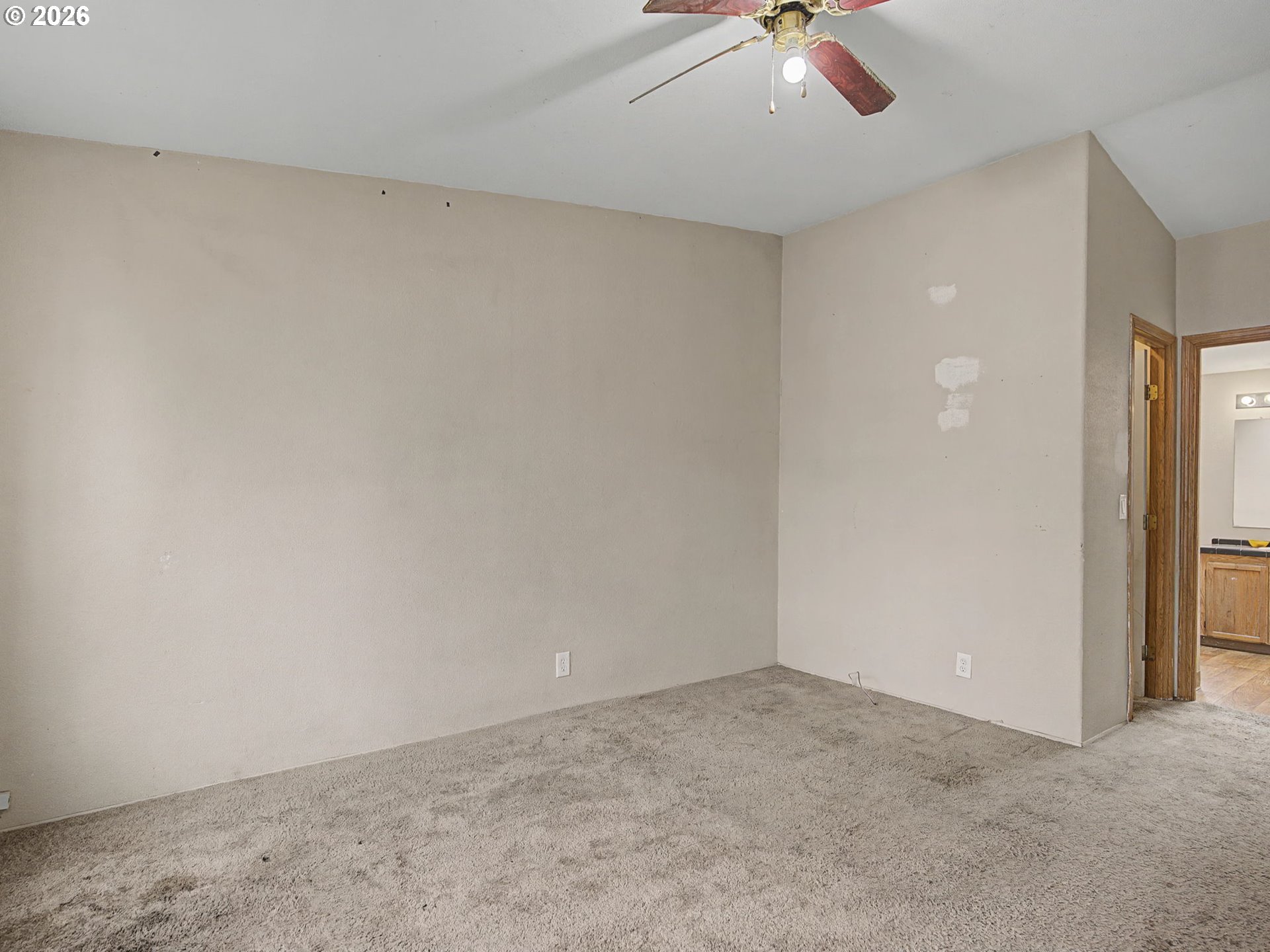 2965 Northeast 206th Place Fairview, OR 97024 - Photo 20 of 44 an empty room with a ceiling fan and carpet