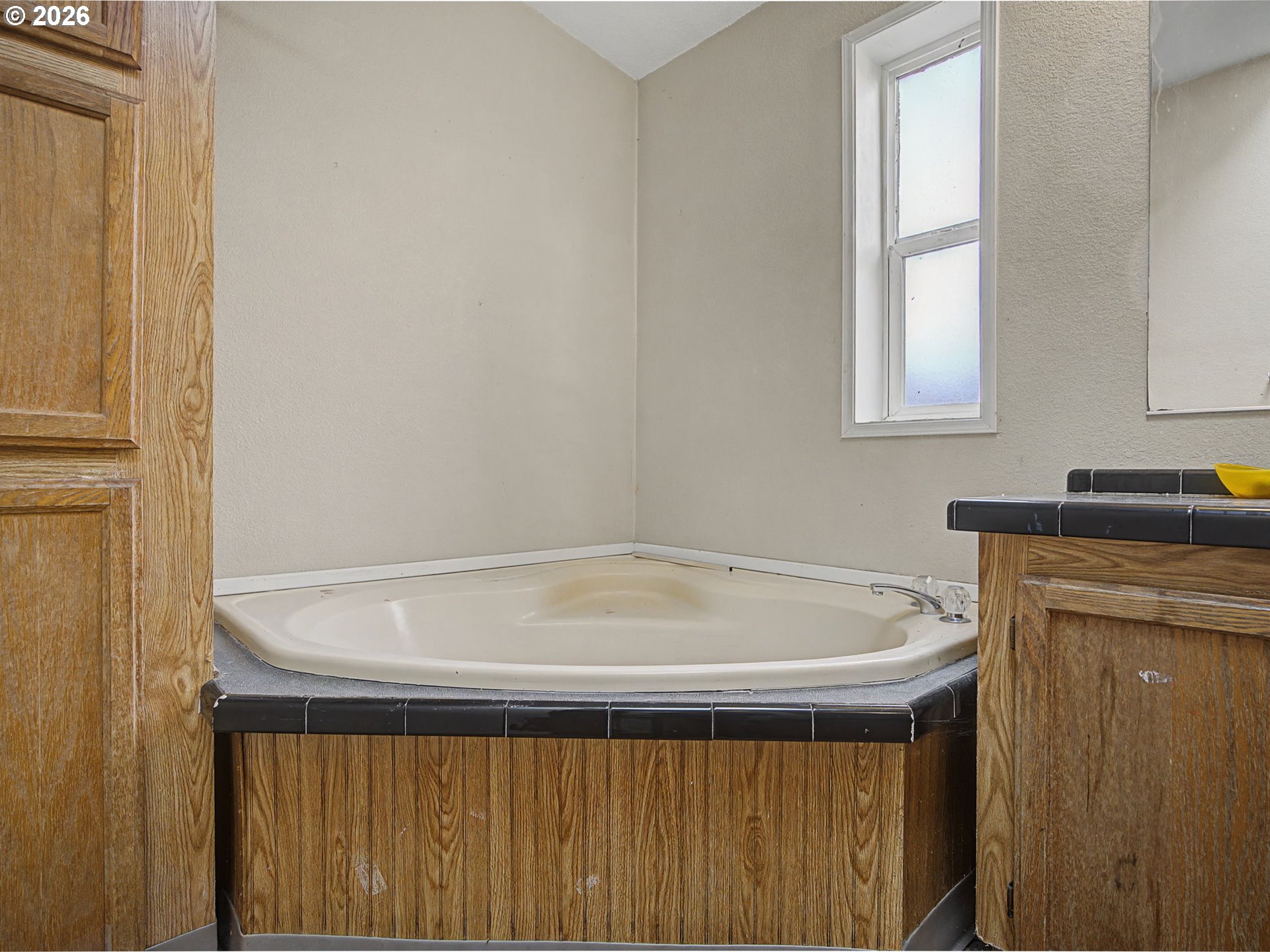 2965 Northeast 206th Place Fairview, OR 97024 - Photo 24 of 44 a bathroom with a bathtub and window
