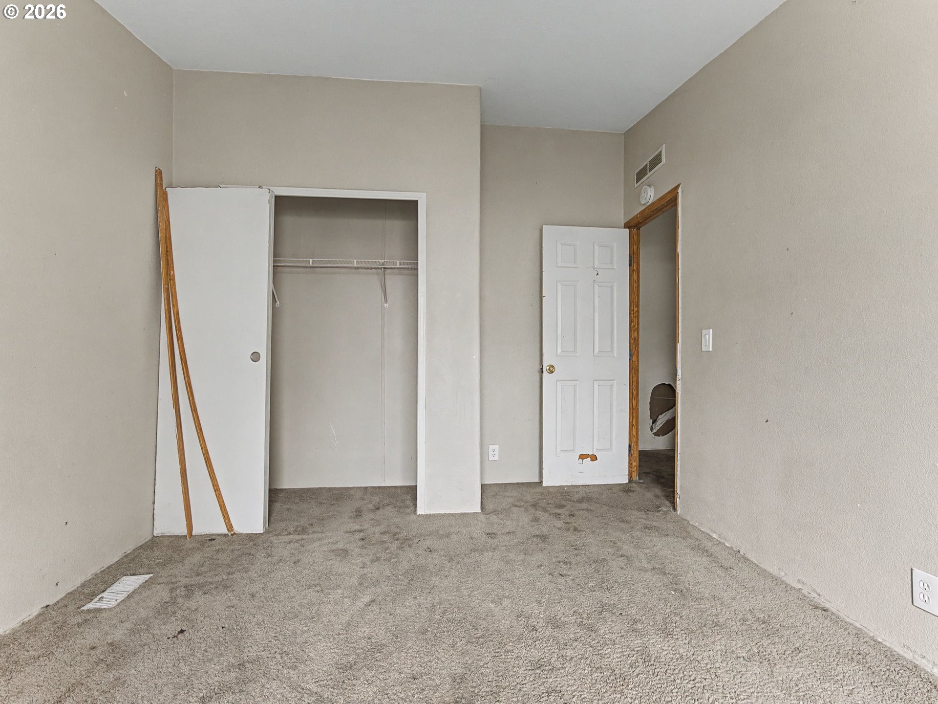 2965 Northeast 206th Place Fairview, OR 97024 - Photo 32 of 44 an empty room with closet and mirror