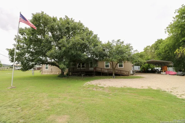 a house with swimming pool in front of it