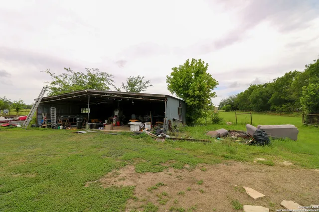 a view of a fire pit in front of a house