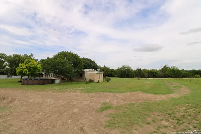 a view of a golf course with a lake