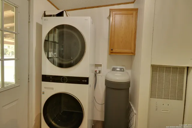 a view of a hallway with washer and dryer