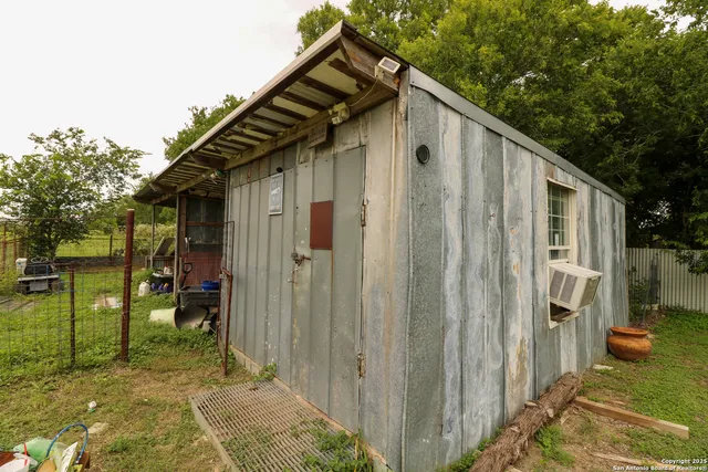 a backyard of a house with seating space