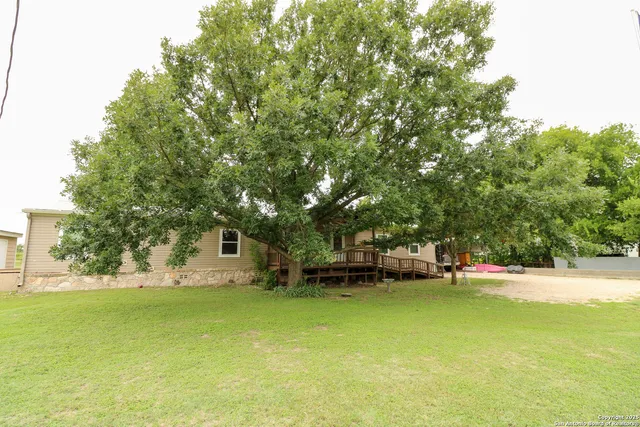 a house with swimming pool in front of it