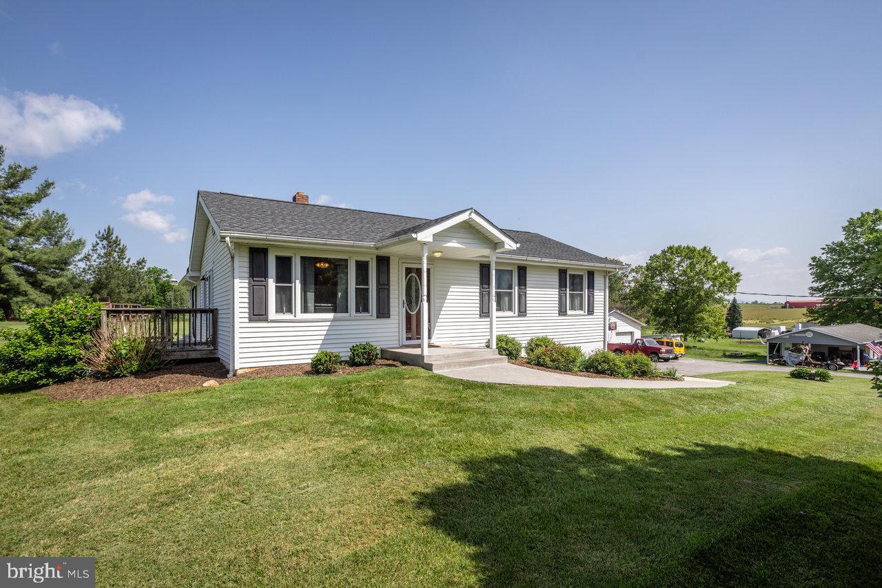 759 Readus Road Edinburg, VA 22824 - Photo 54 of 54 a view of a house with a yard and sitting area