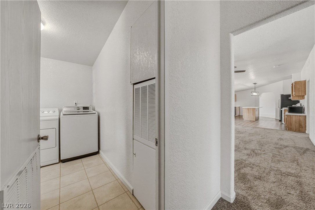 1890 West Dyer Road Pahrump, NV 89048 - Photo 33 of 40 This functional laundry area is equipped for all your household needs.