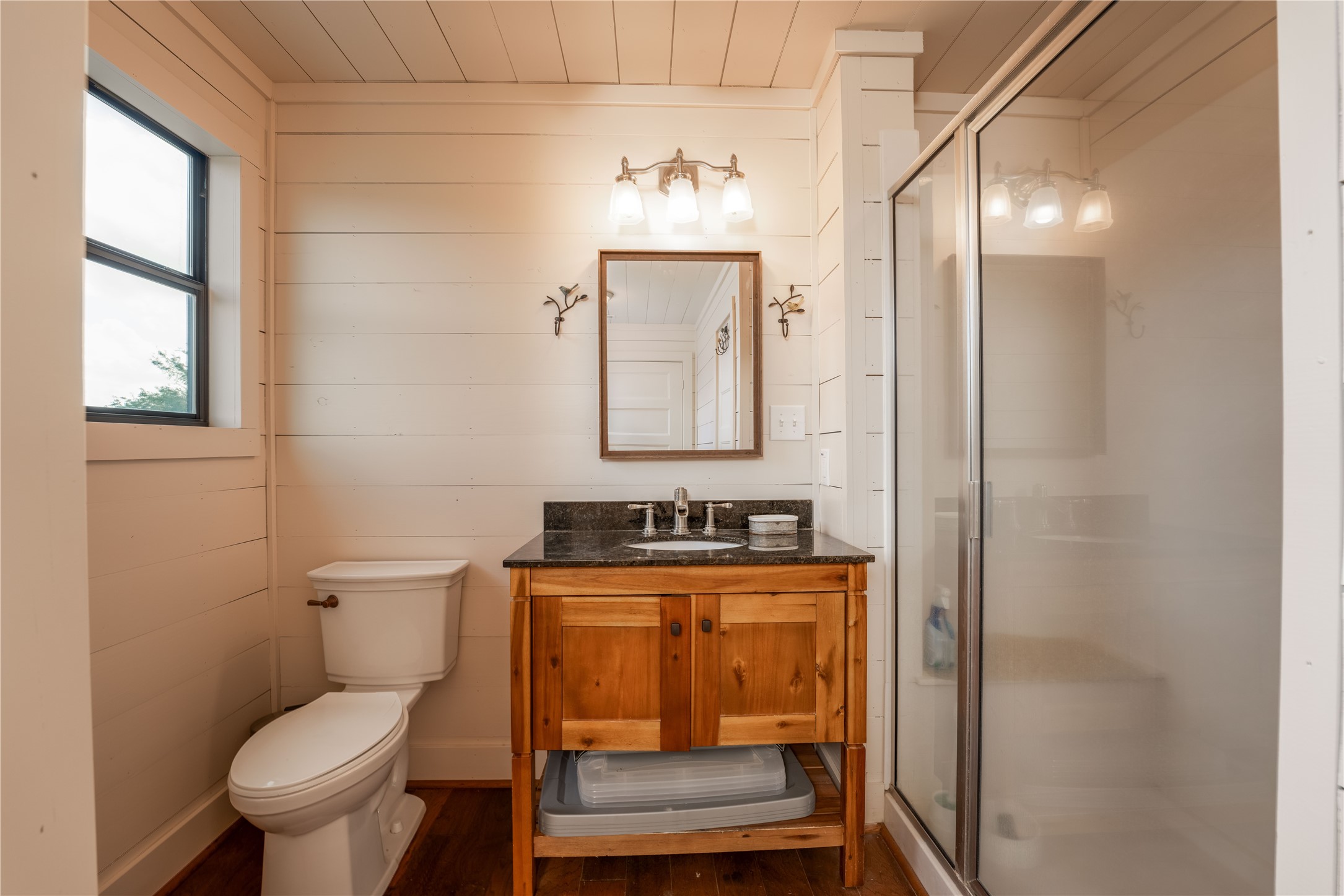 5939 Round Top Road Carmine, TX 78932 - Photo 14 of 28 a bathroom with a toilet a sink and mirror