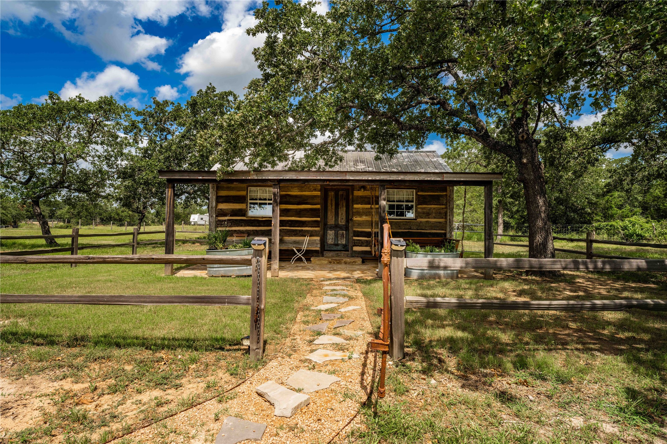 5939 Round Top Road Carmine, TX 78932 - Photo 23 of 28 a view of a swimming pool with an outdoor seating