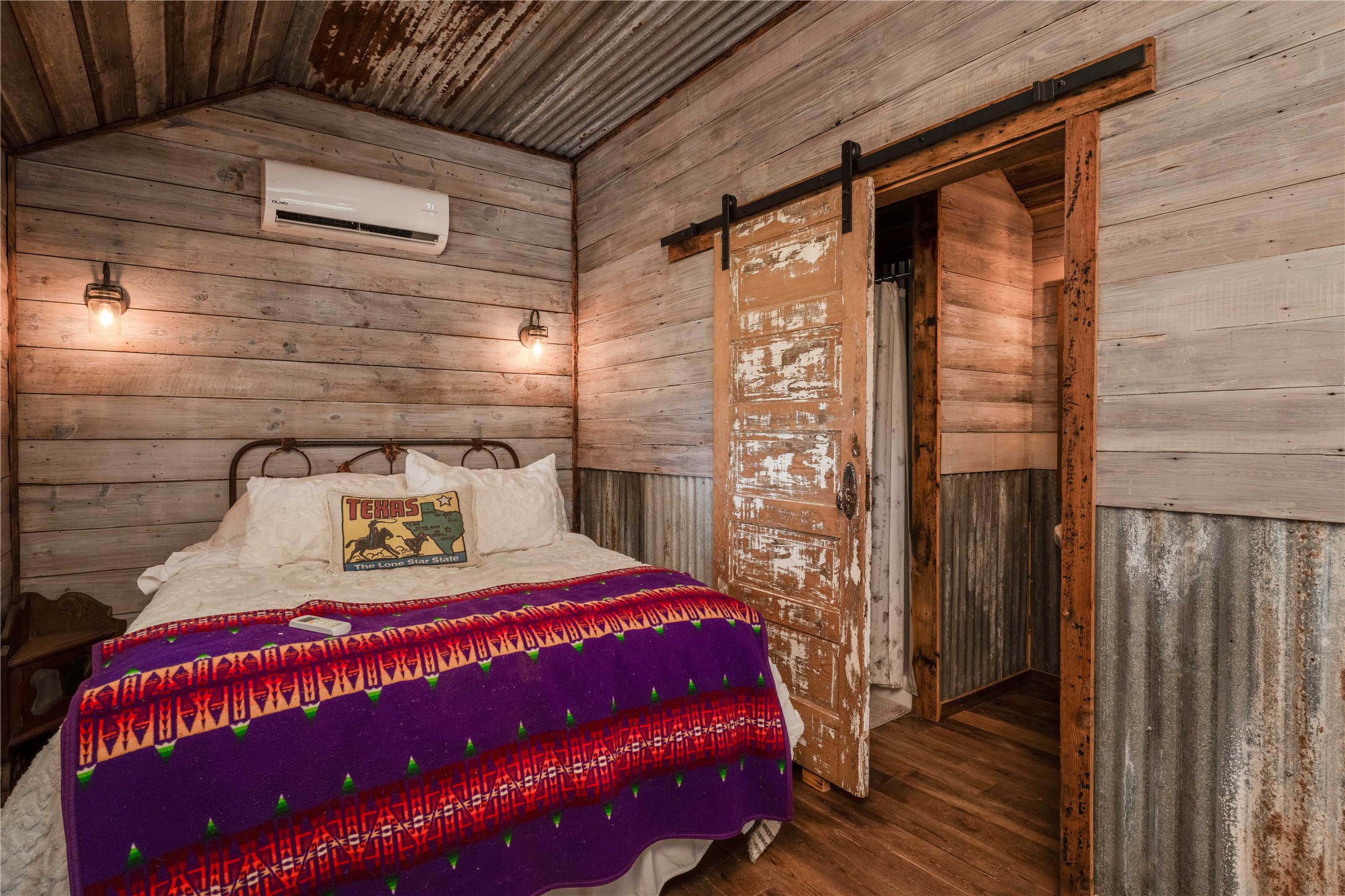 5939 Round Top Road Carmine, TX 78932 - Photo 24 of 28 a bedroom with a bed and a wooden floor