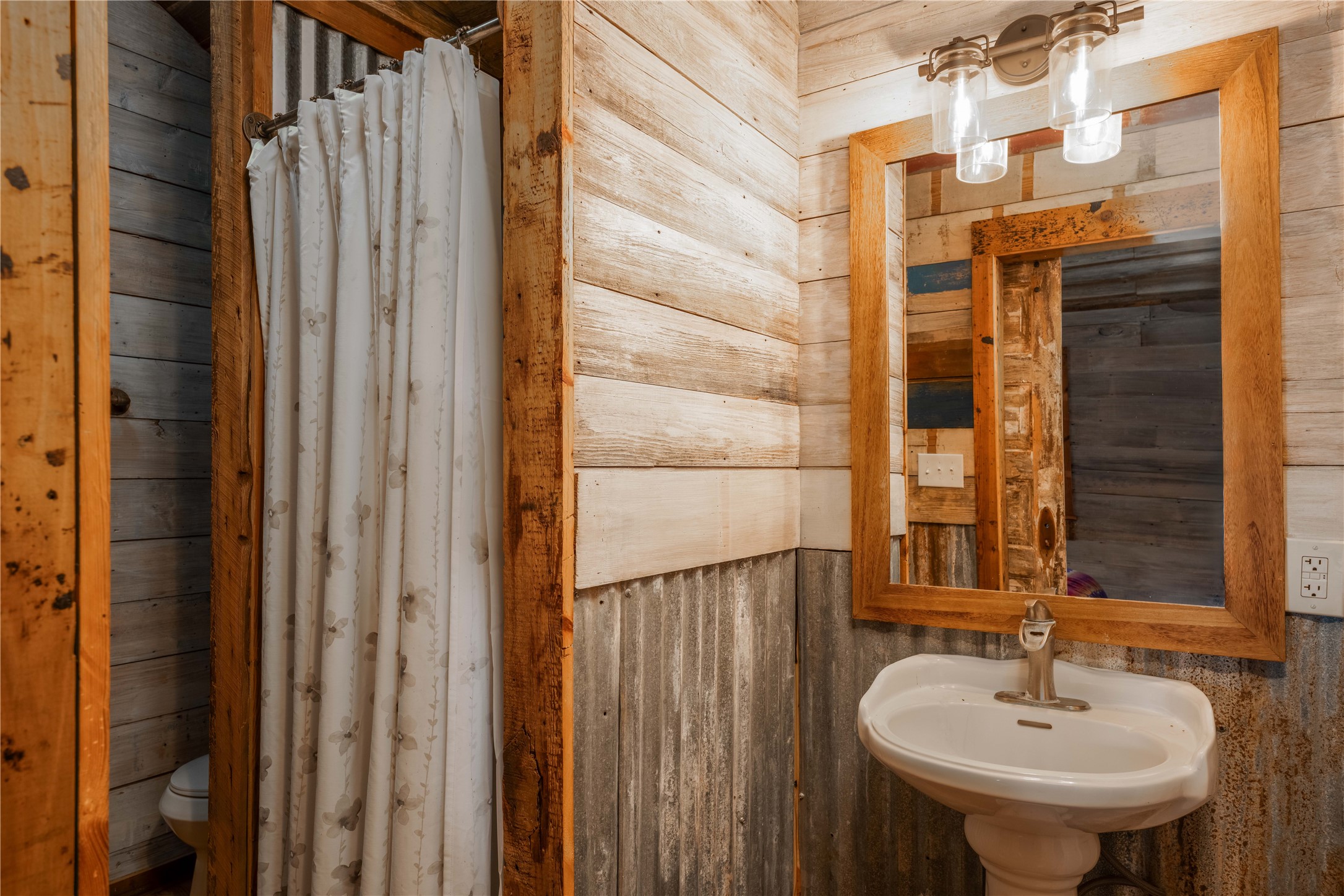 5939 Round Top Road Carmine, TX 78932 - Photo 25 of 28 a bathroom with a sink and a mirror