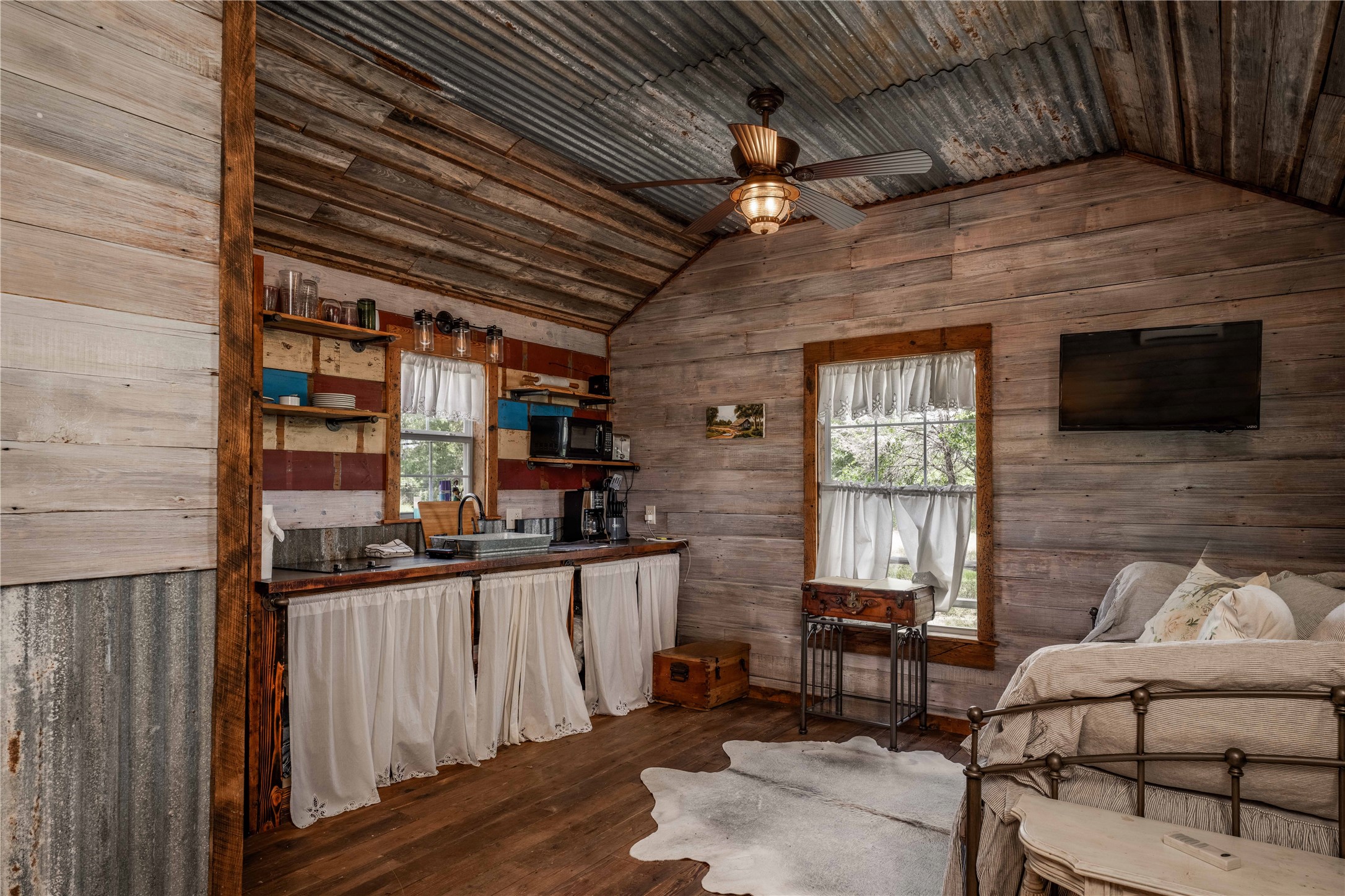 5939 Round Top Road Carmine, TX 78932 - Photo 26 of 28 a living room with furniture a flat screen tv and kitchen view