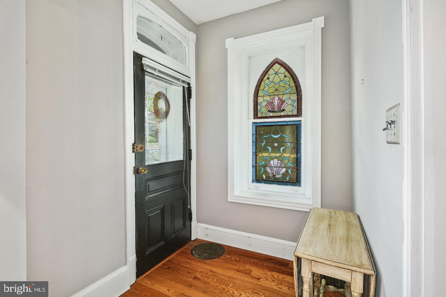 126 Rochelle Avenue Philadelphia, PA 19128 - Photo 4 of 34 Original front door and stained glass window