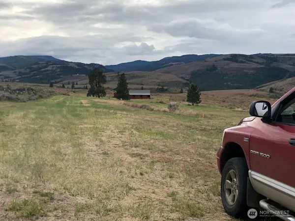 a view of a backyard with mountain view