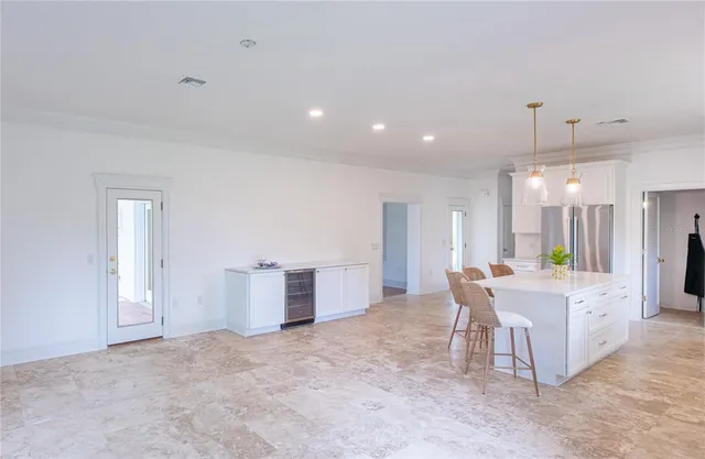 a view of a kitchen and dining area