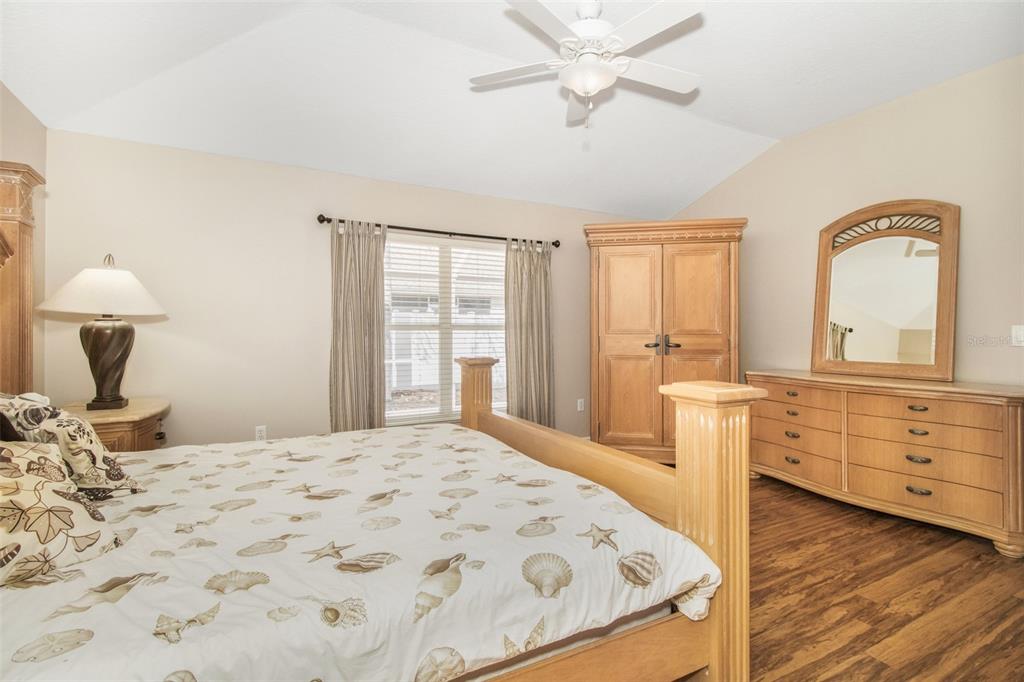 19331 Haskell Place Land O Lakes, FL 34638 - Photo 19 of 34 a bedroom with a bed and a dresser