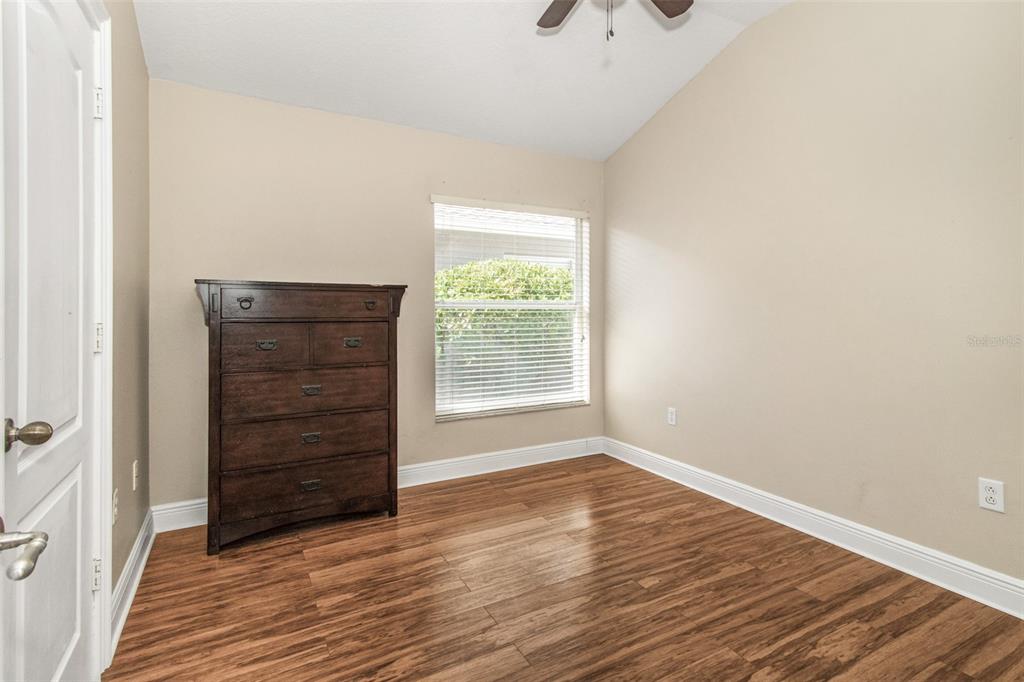 19331 Haskell Place Land O Lakes, FL 34638 - Photo 22 of 34 a view of room with window and hardwood floor