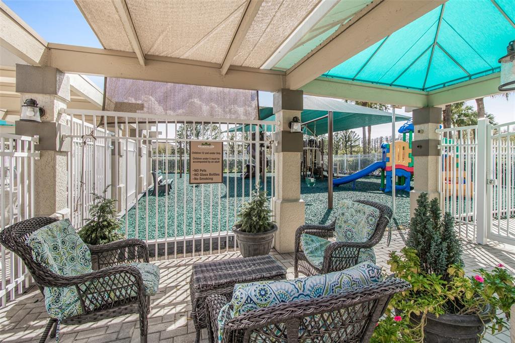 19331 Haskell Place Land O Lakes, FL 34638 - Photo 27 of 34 a outdoor living space with patio furniture and potted plants