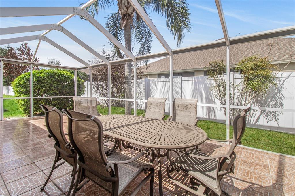 19331 Haskell Place Land O Lakes, FL 34638 - Photo 3 of 34 a view of a patio with a table chairs and a table
