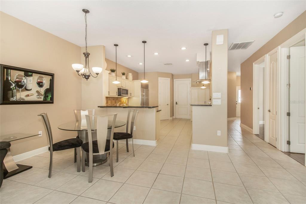 19331 Haskell Place Land O Lakes, FL 34638 - Photo 10 of 34 a view of a kitchen and dining area