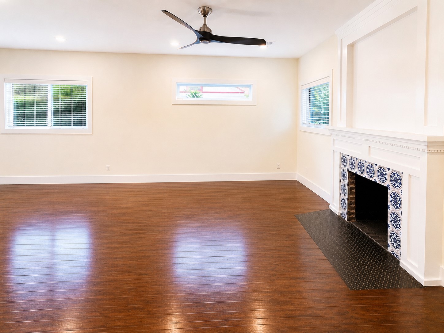 2302 Ruth Street Houston, TX 77004 - Photo 3 of 18 The living room features a mantled gas fireplace surrounded by beautiful tiles.