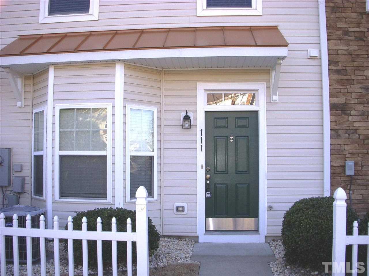 11720 Coppergate Drive, Unit 111 Raleigh, NC 27614 - Photo 1 of 15 a front view of a house with a glass door