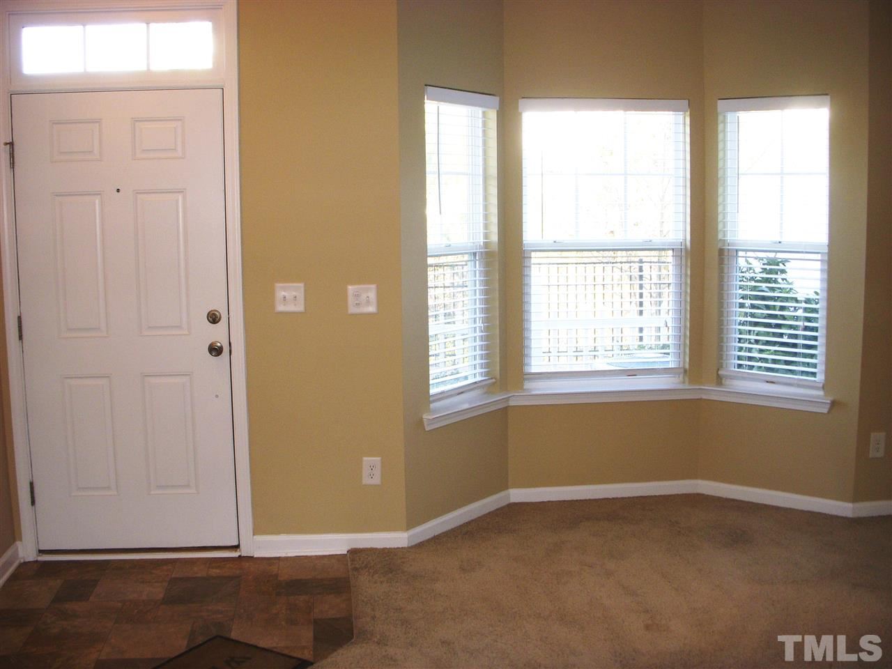 11720 Coppergate Drive, Unit 111 Raleigh, NC 27614 - Photo 7 of 15 an empty room with windows