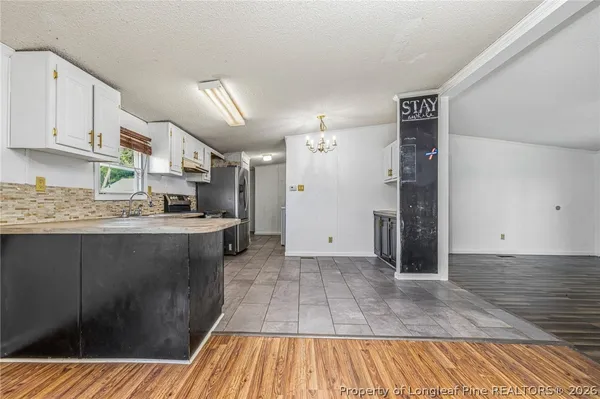 a kitchen with a sink and refrigerator