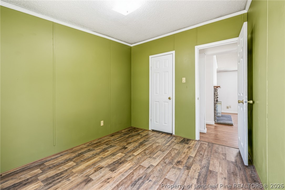 105 Valley Forge Way North Cameron, NC 28326 - Photo 21 of 33 a view of a room with wooden floor and a bathroom