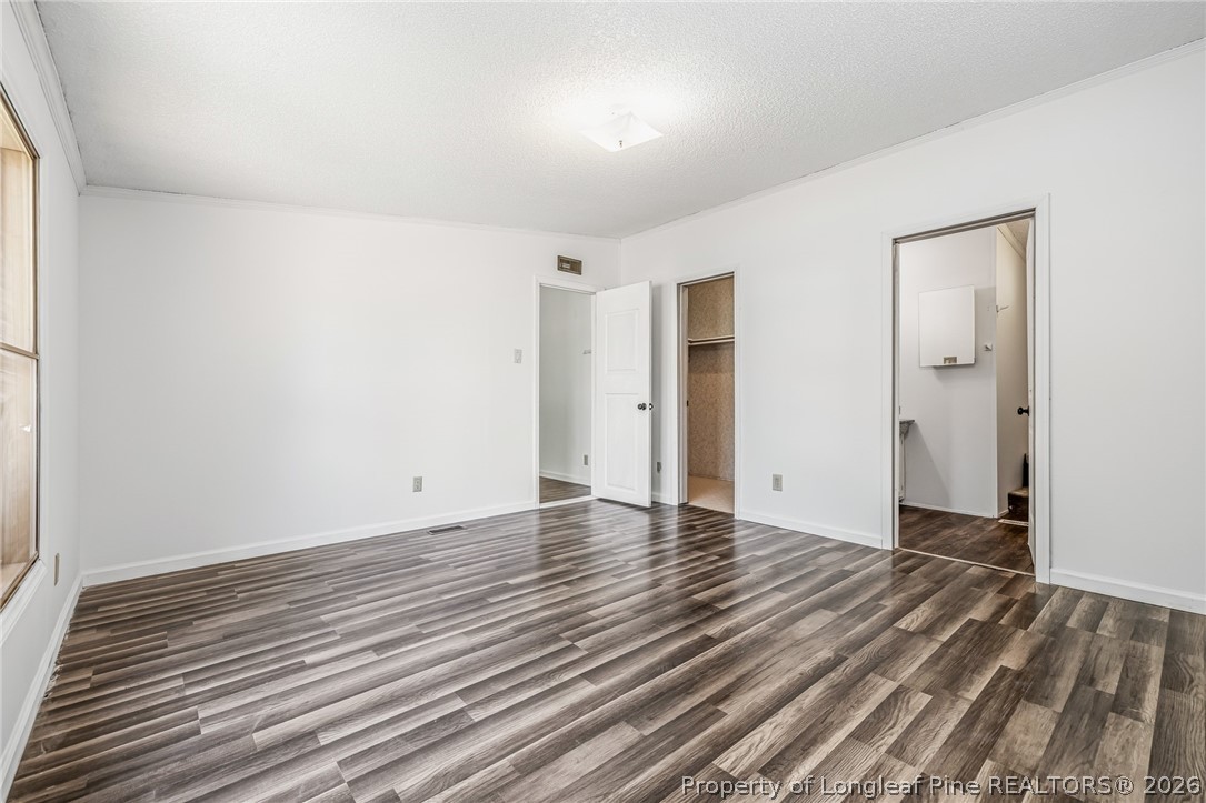 105 Valley Forge Way North Cameron, NC 28326 - Photo 23 of 33 a view of an empty room with wooden floor and a window