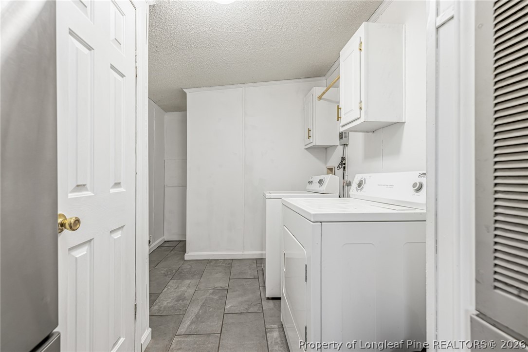 105 Valley Forge Way North Cameron, NC 28326 - Photo 28 of 33 a utility room with cabinets washer and dryer