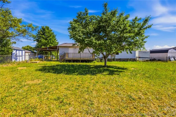 a view of a house with a big yard