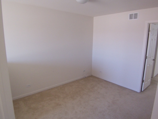 1663 West Turtle Creek Lane Round Lake, IL 60073 - Photo 15 of 25 a room that has a white door