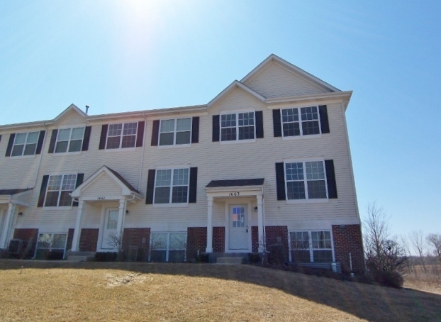 1663 West Turtle Creek Lane Round Lake, IL 60073 - Photo 23 of 25 a front view of a house with a yard