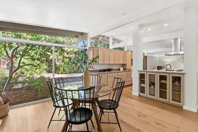 a view of living room with furniture and wooden floor