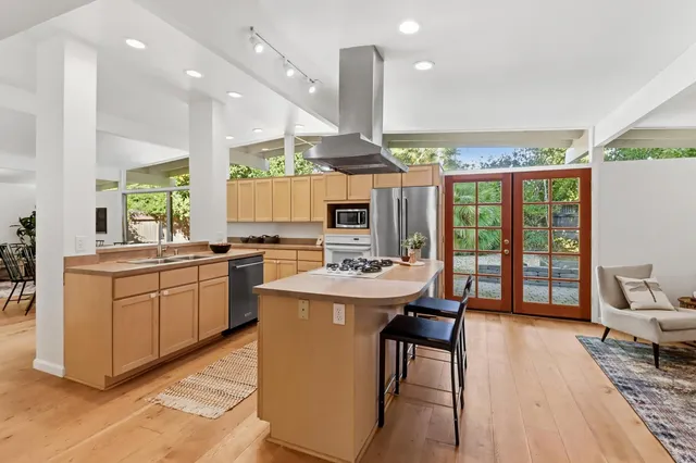 a kitchen with a table and chairs in it