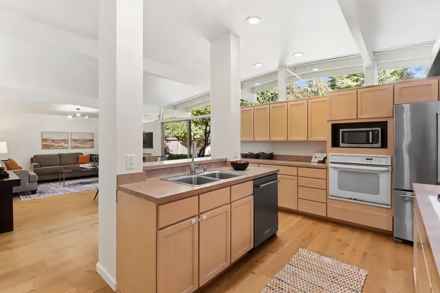 a view of a sink and cabinets