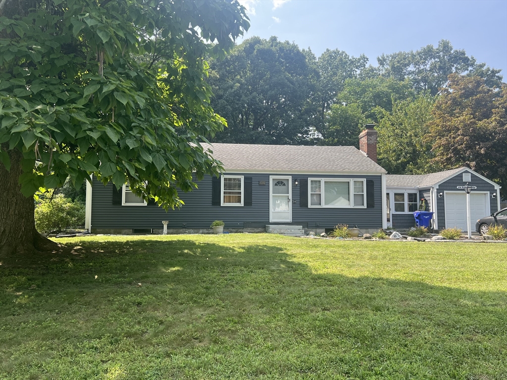 64 Fox Hill Road Springfield, MA 01118 - Photo 1 of 14 a front view of a house with a garden