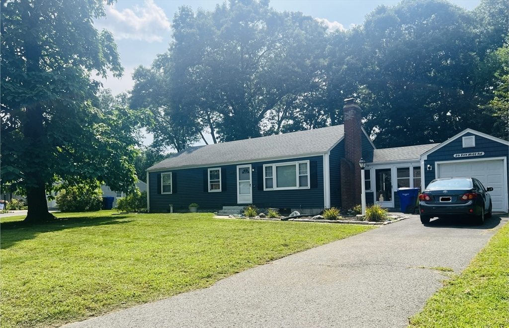 64 Fox Hill Road Springfield, MA 01118 - Photo 2 of 14 a front view of a house with a yard and trees