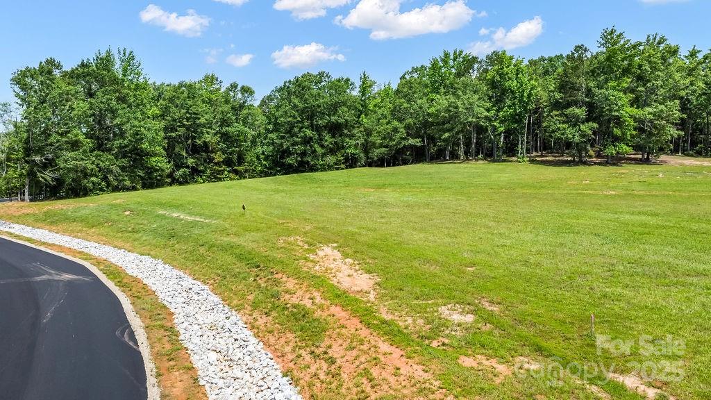 130 Flowing Rock Road, Unit 3 Honea Path, SC 29654 - Photo 2 of 7 a view of a yard with a house in the background