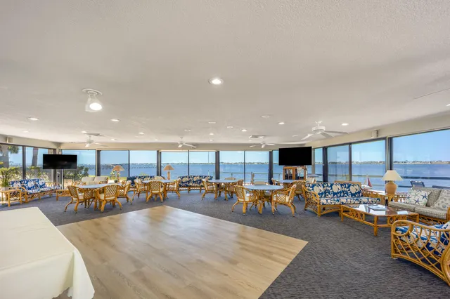 a swimming pool with outdoor seating and yard